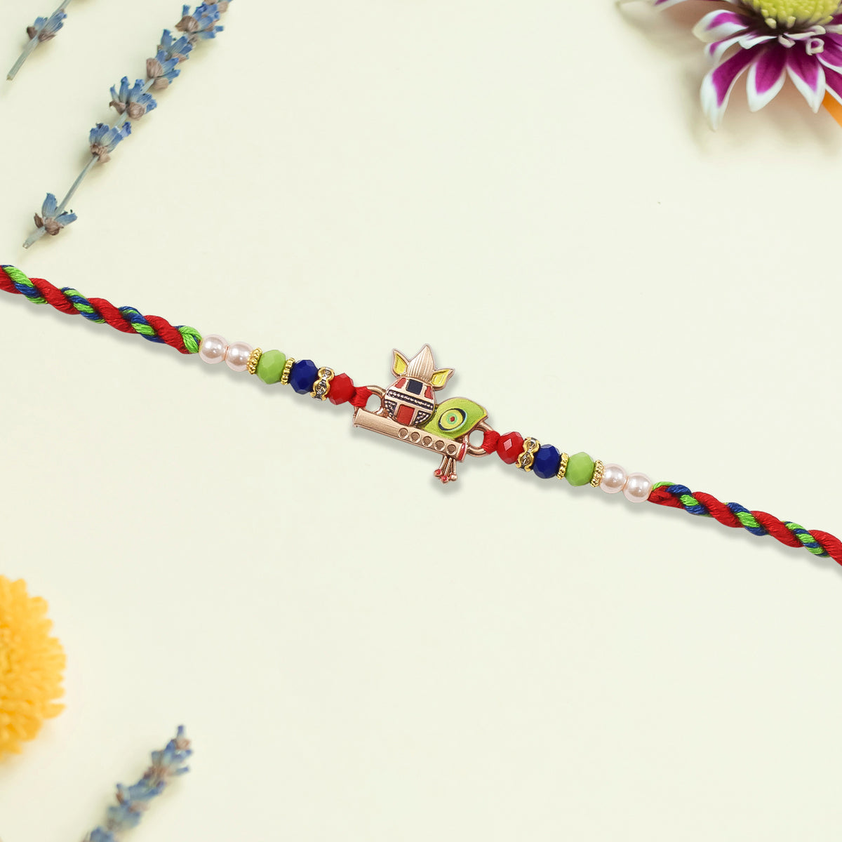 Kalash Rakhi With Flute And Peacock Feather