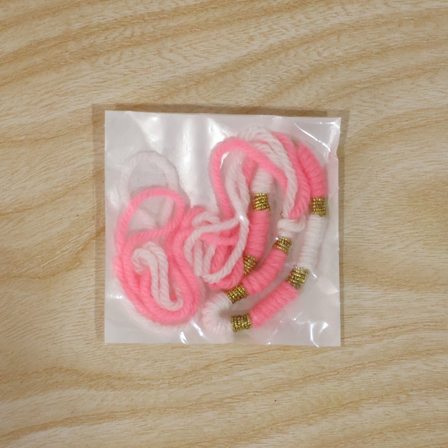 Cute Pink White Thread Rakhi For Brother With Golden Beads (1 Pc)