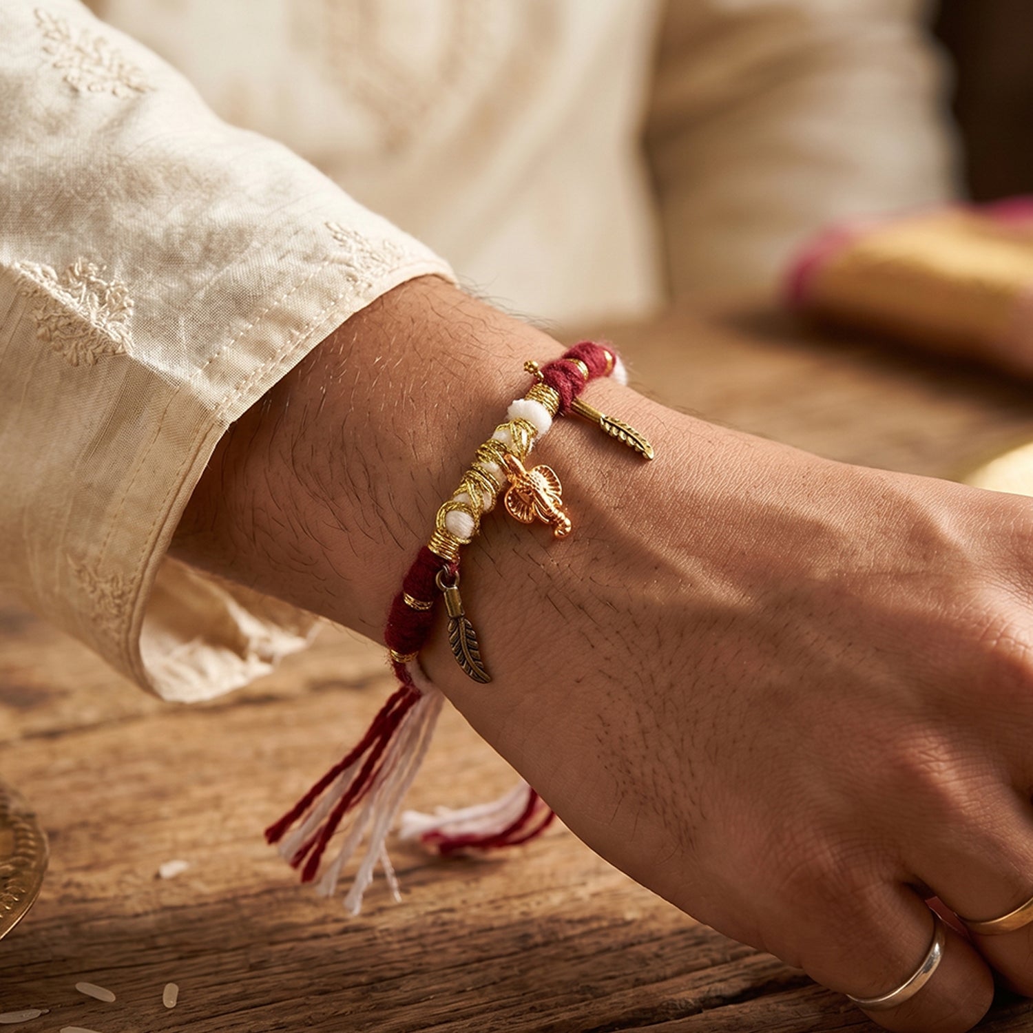 Decorative Thread Rakhi Bracelet With Ganesh  Feather Charms (1 Pc)
